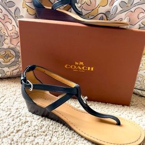 Beautiful black Coach sandals with a small platform. Size 7.5. Brand new.